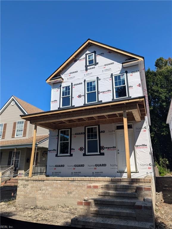 property under construction featuring a porch