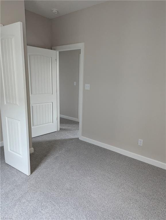 unfurnished bedroom with carpet flooring