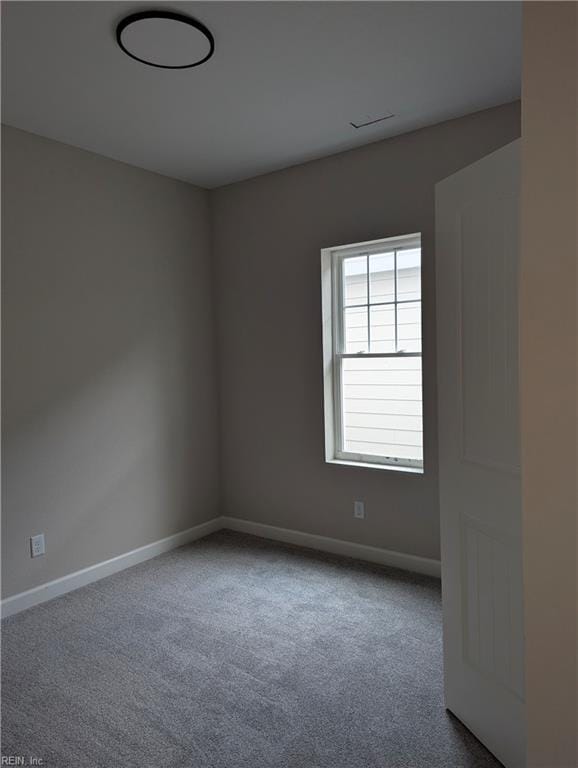 spare room featuring carpet flooring