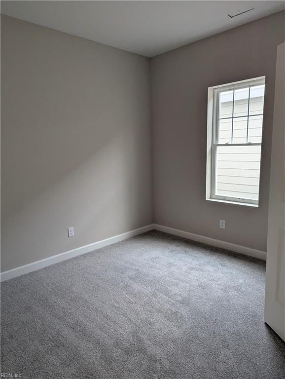 unfurnished room with carpet floors