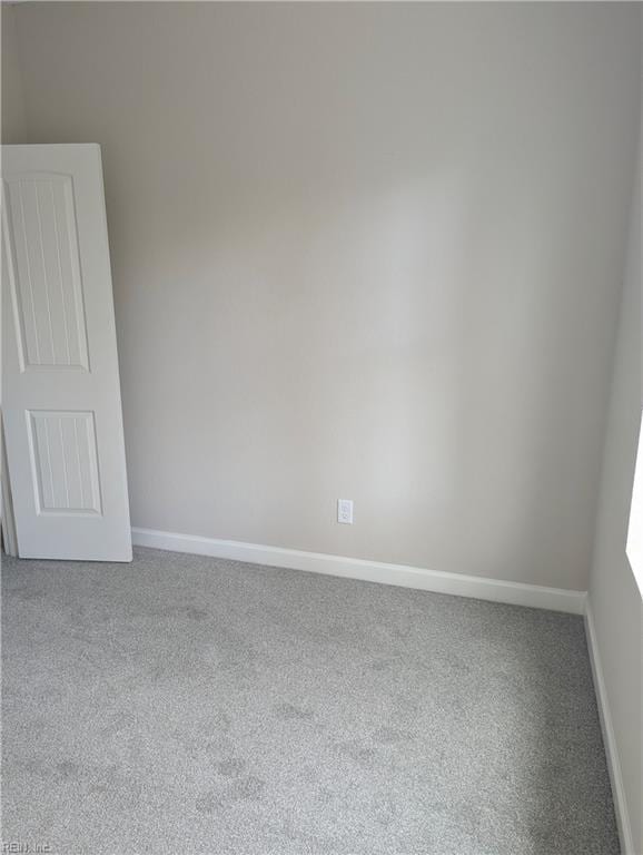 unfurnished room featuring carpet floors