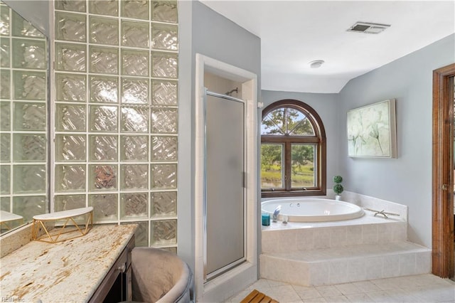 full bathroom with vanity, toilet, independent shower and bath, and tile patterned floors