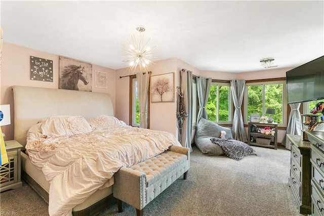 carpeted bedroom with a chandelier