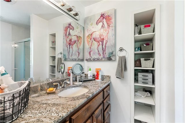 full bathroom featuring vanity and a shower stall