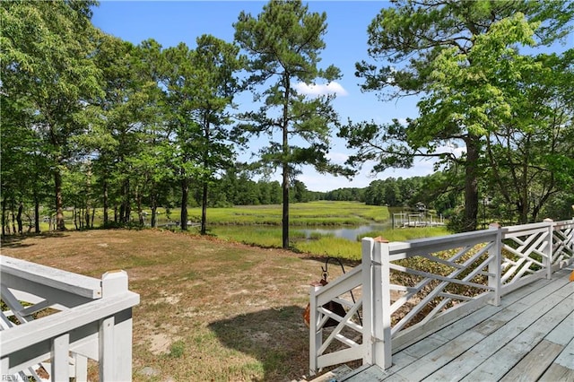 view of yard featuring a deck with water view