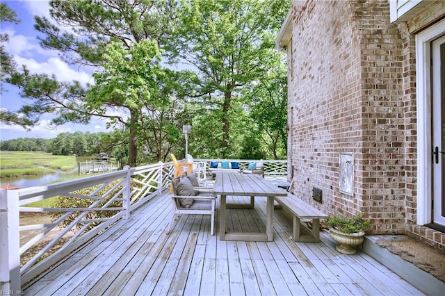 wooden deck with an outdoor living space