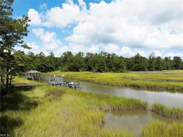 exterior space featuring a water view and boat lift