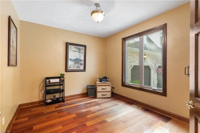 foyer entrance with high vaulted ceiling and hardwood / wood-style flooring