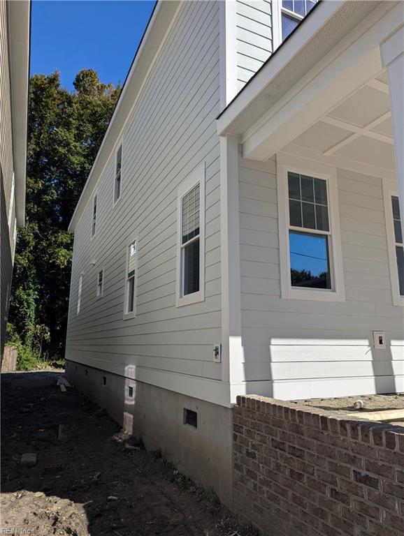 view of side of home with crawl space