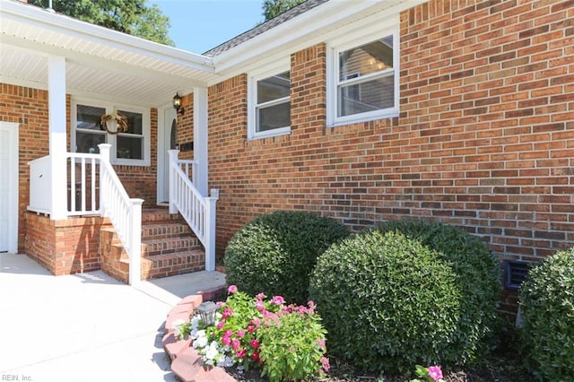 doorway to property featuring covered porch