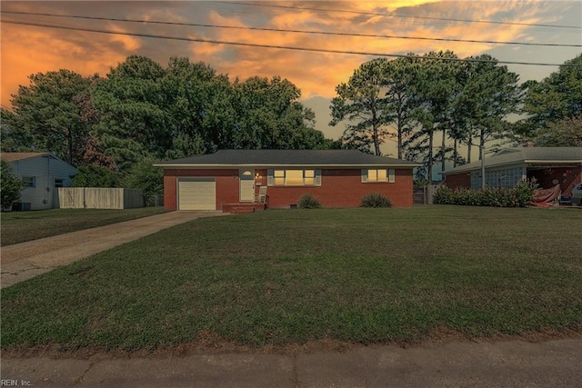 ranch-style home featuring a yard