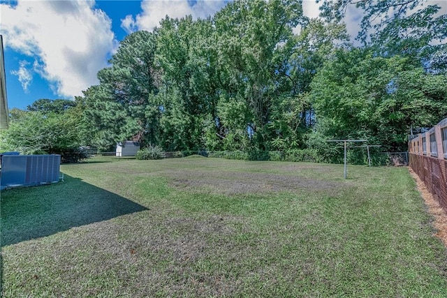 view of yard with central AC unit