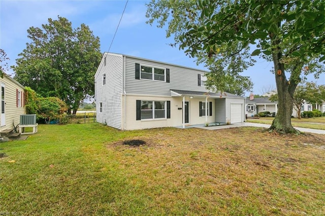 view of front property featuring a front lawn and central air condition unit