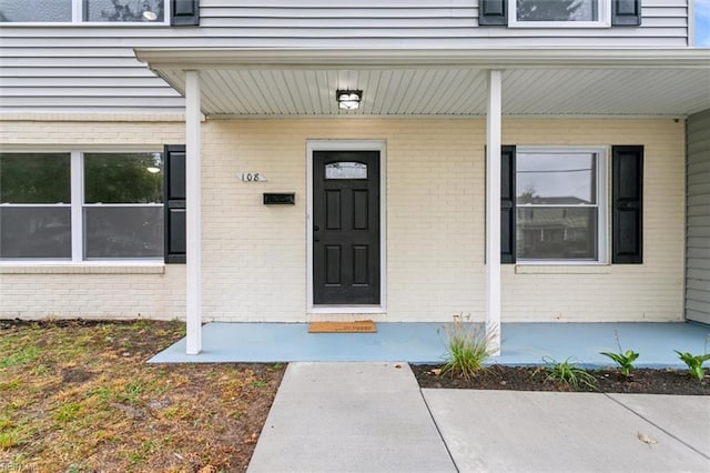 property entrance with a porch