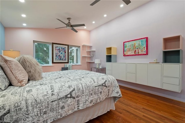 bedroom featuring lofted ceiling, ceiling fan, and hardwood / wood-style flooring