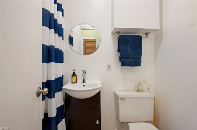 bathroom with toilet and sink