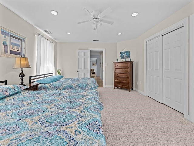 bedroom featuring carpet floors, ceiling fan, and a closet