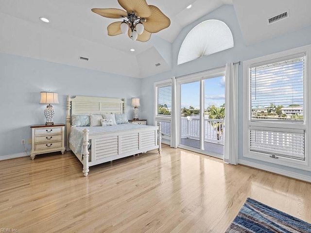 bedroom featuring ceiling fan, light hardwood / wood-style floors, access to outside, and vaulted ceiling