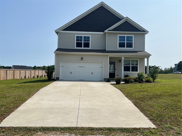 view of front of home featuring a garage and a front lawn