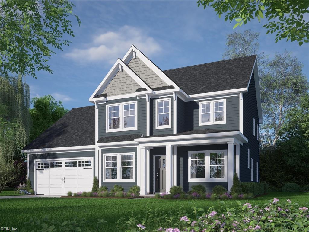 view of front facade with a front lawn and a garage