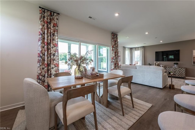 dining room with dark wood-type flooring