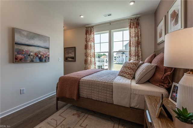 bedroom featuring dark hardwood / wood-style floors