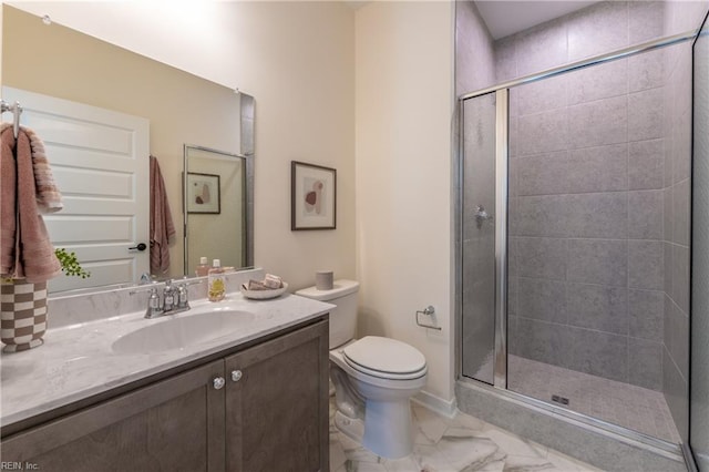 bathroom with walk in shower, vanity, and toilet