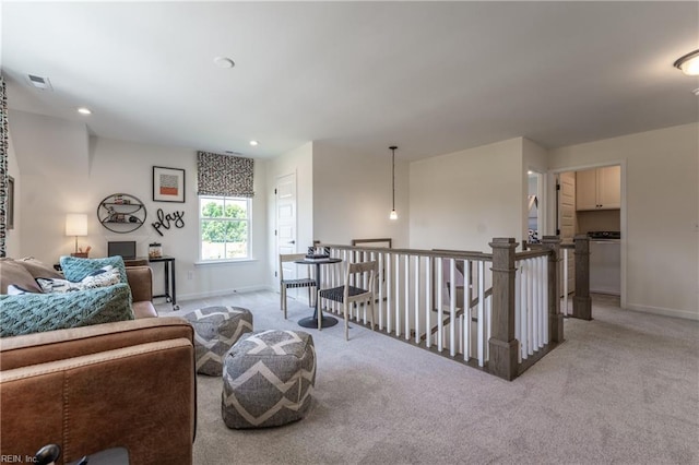 2226 Patrick Dr, Suffolk, VA 23435 - living area featuring light carpet, an upstairs landing, and visible vents