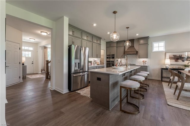 2226 Patrick Dr, Suffolk, VA 23435 - kitchen with baseboards, gray cabinetry, light countertops, appliances with stainless steel finishes, and premium range hood