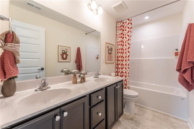 full bathroom with vanity, toilet, and shower / tub combo with curtain