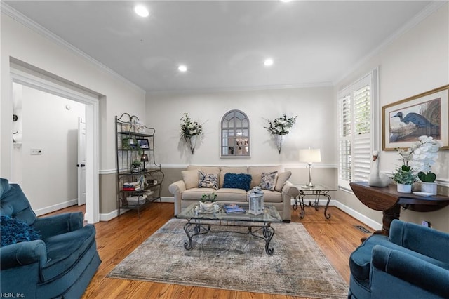 living room with ornamental molding and hardwood / wood-style flooring