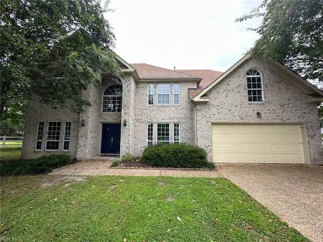 view of front of property featuring a garage and a front yard