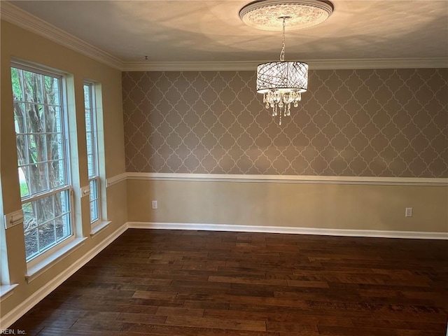 unfurnished dining area with crown molding, dark wood-type flooring, and a notable chandelier