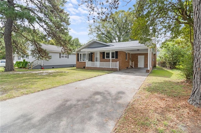 ranch-style home with a carport and a front yard