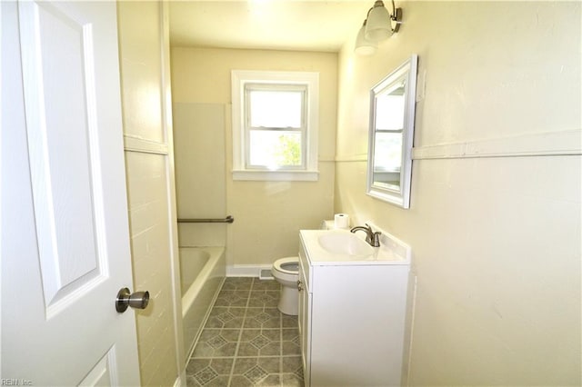 bathroom with tile patterned flooring, toilet, and vanity