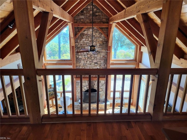 details with a fireplace, beam ceiling, and hardwood / wood-style flooring