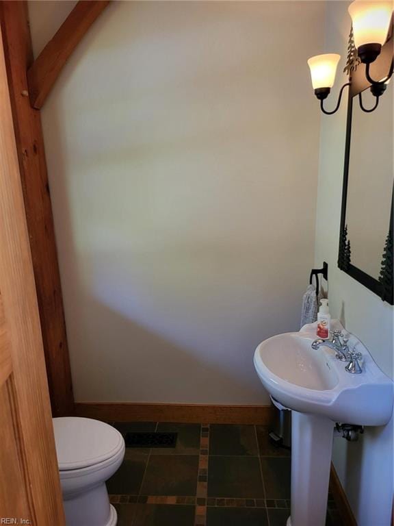 bathroom featuring tile patterned flooring and toilet