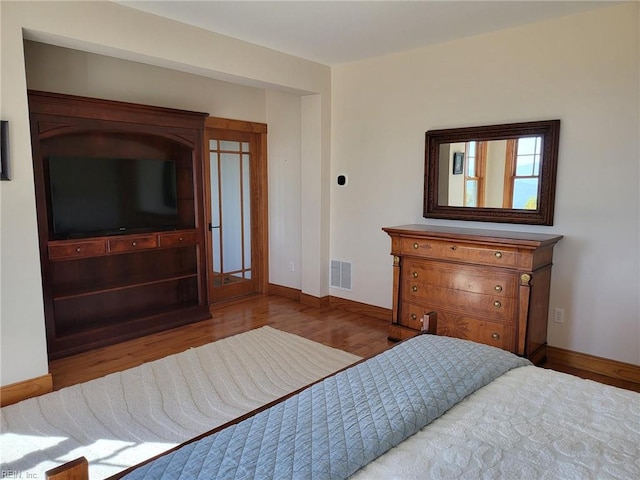 bedroom featuring light hardwood / wood-style floors