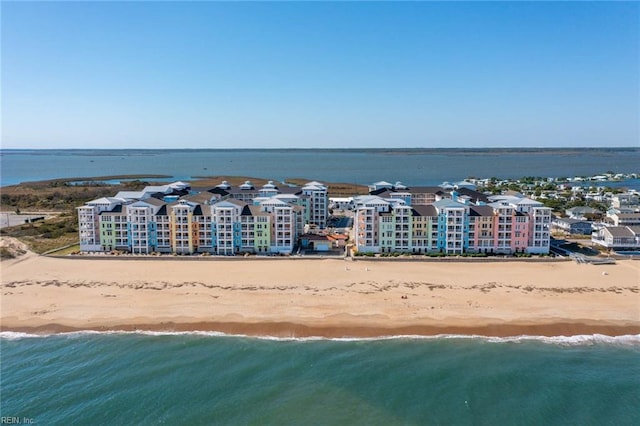 aerial view with a water view and a beach view