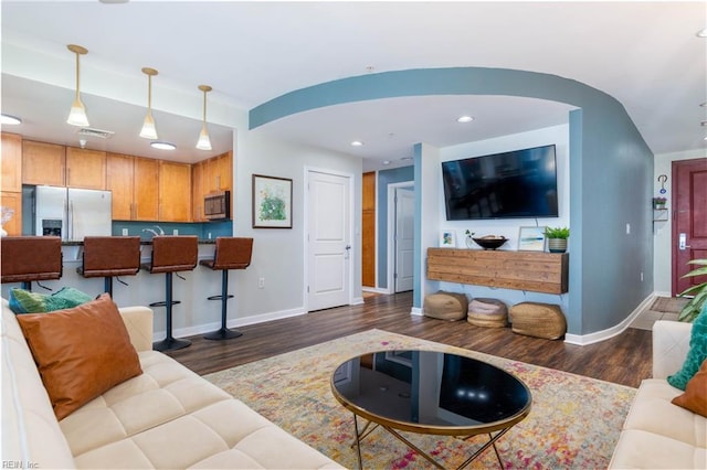 living room featuring dark hardwood / wood-style floors