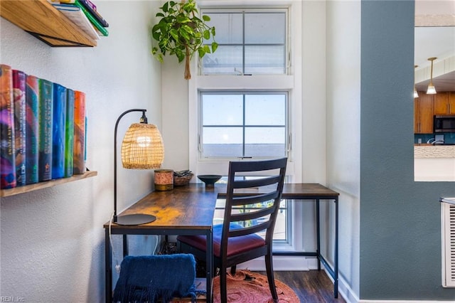 dining room with dark hardwood / wood-style floors