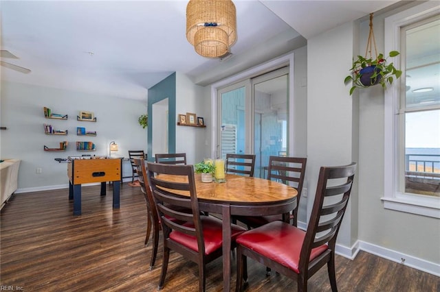 dining room with dark hardwood / wood-style floors