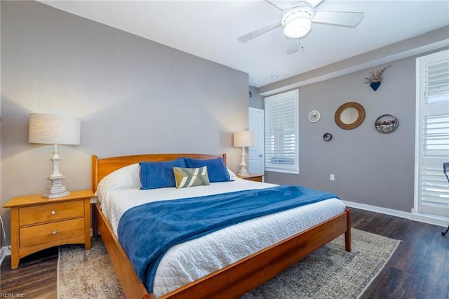 bedroom featuring ceiling fan and dark hardwood / wood-style floors