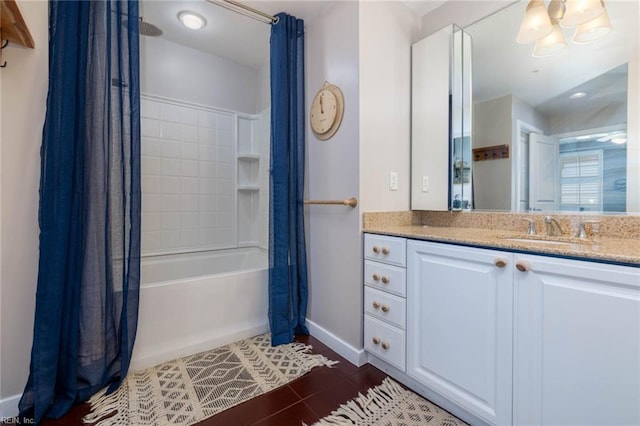 bathroom with shower / bath combo, tile patterned flooring, and vanity