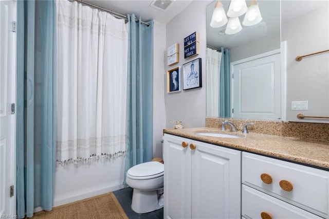 bathroom with vanity, toilet, a chandelier, a shower with curtain, and tile patterned flooring