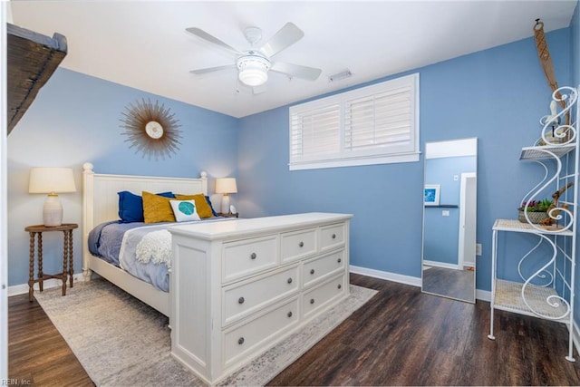 bedroom featuring ceiling fan and dark hardwood / wood-style floors