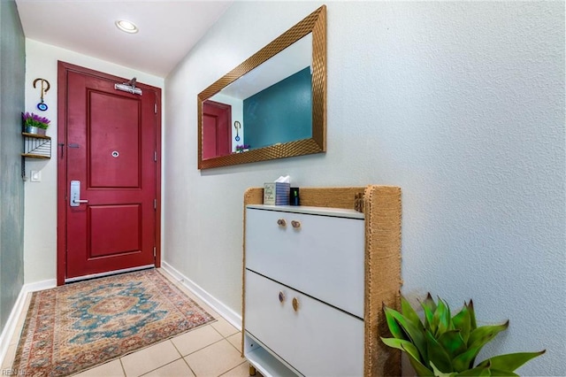 entryway featuring light tile patterned floors