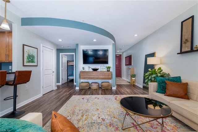 living room with dark hardwood / wood-style floors