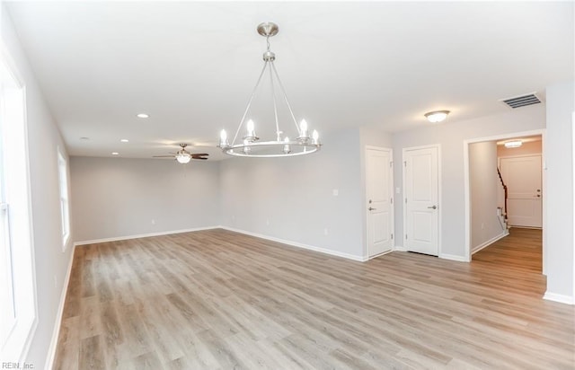 empty room with light hardwood / wood-style flooring and ceiling fan