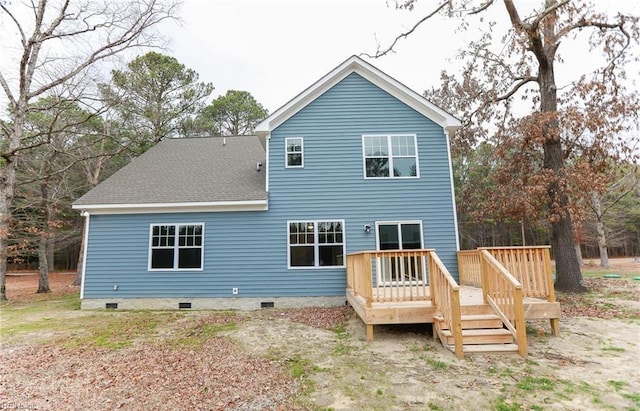 back of property with a wooden deck